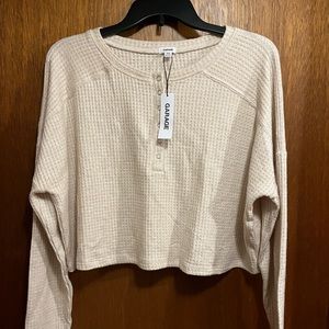Cropped garage long sleeve top. Soft material, size M. Brand new with tags